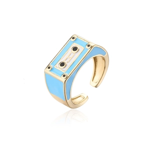 Detailed side view of adjustable retro gold and blue cassette tape open ring design