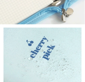 Waterproof glitter binder cover in sky blue with cherry print and metallic zipper detail
