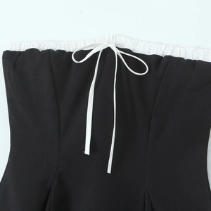 Retro black and white strapless dress with elegant bow detail and pleated trim