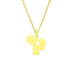 Close-up of golden Venezuela map pendant with heart cutout and polished finish