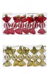 Detail of red and gold candy-shaped Christmas tree ornaments with glitter stripes