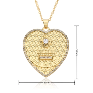 Detail view of a 26x30mm gold heart cross pendant with French text and zircon inlay