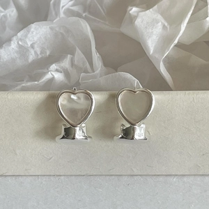 Minimalist 925 sterling silver heart earrings with shell inlay on cream background