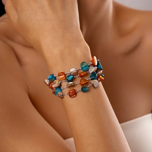 Multi-layer geometric bracelet featuring polished colorful stones and shell accents