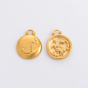Detailed view of gold Scorpio zodiac charms with star map and embossed scorpion design