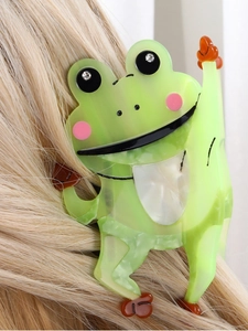 Detailed view of the cute green frog hair claw clip made of glossy acetate material
