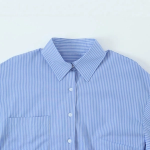 Blue and white pinstriped oversized shirt featuring a classic collar and front pocket