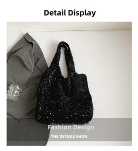 Detail showing the shimmering black sequin texture and wide strap of the stylish tote bag