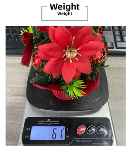 Detailed macro view showing a 61g lightweight mini red poinsettia Christmas tabletop ornament