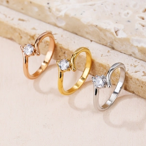 Luxurious criss-cross diamond rings in rose gold, gold, and silver finishes for women
