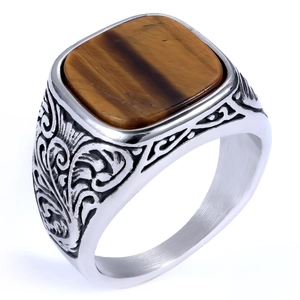 Vintage silver ring featuring a square tiger eye stone with ornate floral carvings