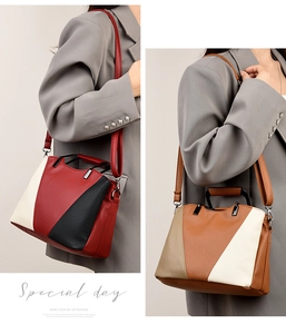 Trapezoidal faux leather tote bag in tricolor panels with top handle and shoulder strap