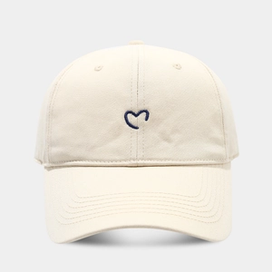 Minimalist cream cotton baseball cap with navy blue heart embroidery and curved brim