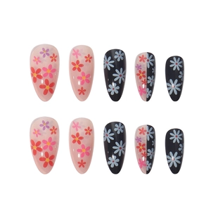 Floral stiletto press-on nails set with pink and black base designs for DIY manicure