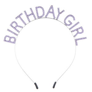Close-up of silver metal headband with purple rhinestone BIRTHDAY GIRL lettering
