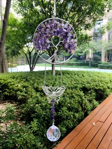 Detailed view of handmade amethyst tree of life suncatcher with silver butterfly and crystal ball