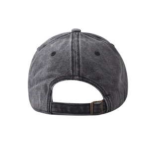 Detail view of washed cotton baseball cap featuring adjustable back strap with brass buckle