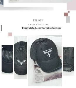 Macro view of distressed grey baseball cap with God Wins embroidery and metal buckle