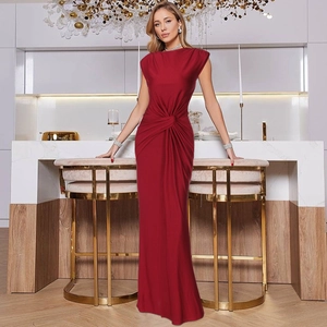 Detail showing twist knot pleated waist on a burgundy sleeveless evening gown