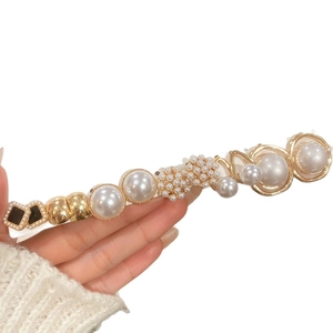 Elegant floral pearl hair clip with gold metal rings and black square accents