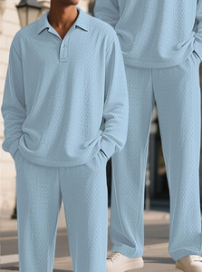 Detail of light blue men's polo set featuring distinctive diamond texture knit fabric