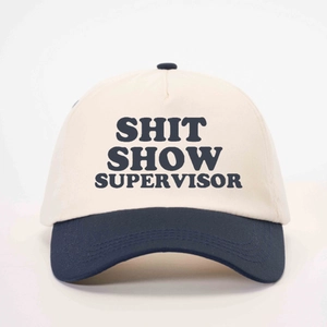Two-tone baseball cap with SHIT SHOW SUPERVISOR print in beige and dark blue