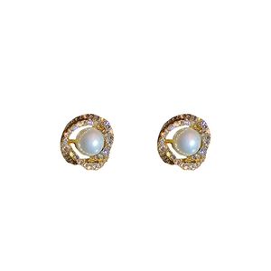 Elegant gold earrings with pearls and crystal accents on a clean white background