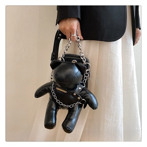 Close-up of matte black bear-shaped PU leather bag with chunky silver metal chains