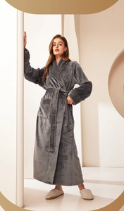 Detail of dark grey flannel bathrobe showing embossed texture on the lapel and cuffs