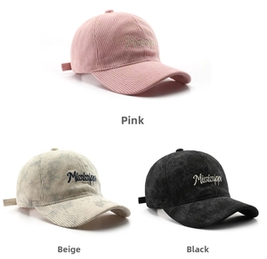 Detailed close-up of corduroy baseball caps with Mississippi embroidery in three colors