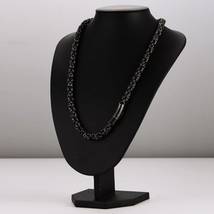 Men's punk style black stainless steel multi-layer woven chain necklace on mannequin