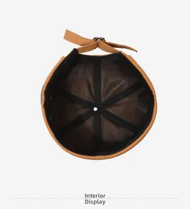 Detailed interior view of the brown docker hat showing black reinforced webbing and top vent