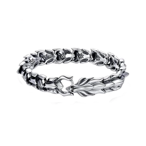 Detailed close-up of a vintage punk dragon head clasp on a silver keel chain bracelet
