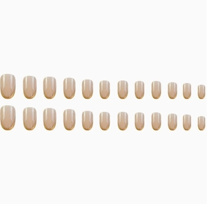 Flat lay of 24-piece golden French nude pink press-on nails set on white background