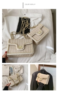 Detail of straw woven crossbody bag featuring elegant pearl edges and golden chain strap