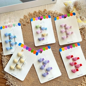 Cute heart-shaped checkered hair clips in various candy colors displayed on six cards
