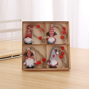 Set of four wooden Christmas gnome pendants in a tray with red beads and twine hangers