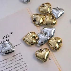Polished heart shaped metal pendants in gold and silver finish for DIY jewelry