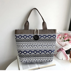 Ethnic geometric canvas tote bag featuring unique cotton cord and large button closure