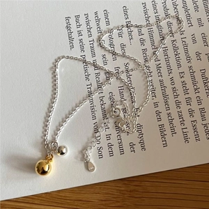 S925 sterling silver necklace with dual gold and silver bead pendants on O-chain link