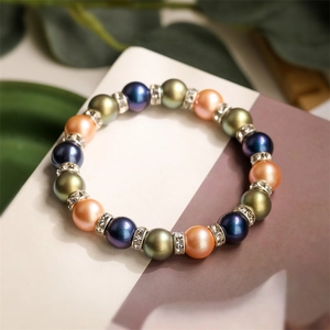 Detailed shot of multi-colored agate beads with rhinestone spacers in silk luster finish