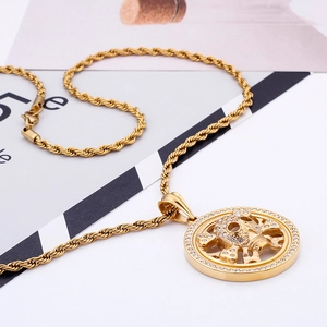 Close-up of hip-hop gold skull pendant with sparkling crystals and rope chain link