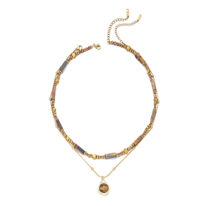 Double-layered golden necklace featuring brown tiger eye beads and round stone pendant