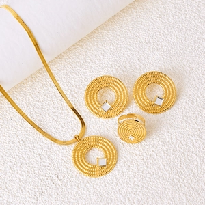 Golden jewelry set featuring radial wave texture necklaces, earrings, and rings with square zircon