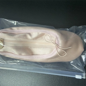 Pink satin ballet slipper pencil case with ribbon bow detail in clear packaging