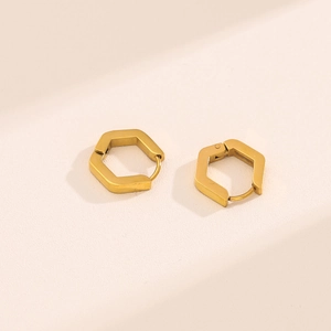 Detailed macro view of 18K gold plated stainless steel hexagonal hoop earrings