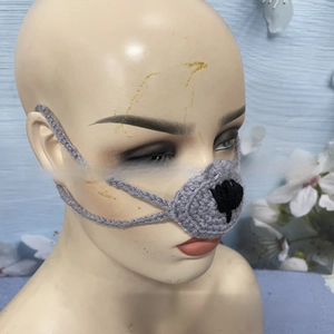 Detail view of handmade crochet nose warmer in grey yarn on a mannequin head