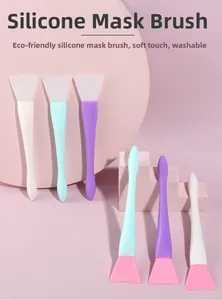 Eco-friendly silicone mask brushes in assorted colors displayed on a modern podium