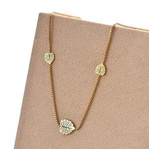 Gold titanium steel box chain necklace featuring three delicate hollow leaf pendants