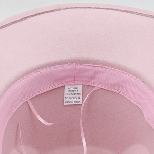 Pink rhinestone cowboy hat interior showing soft polyester lining and adjustable sweatband